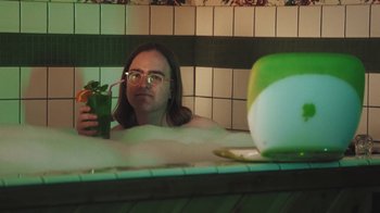 Movie still from “Dent May - I Could Use A Miracle” (2020), directed by Nathan Castiel – Medium shot, High angle