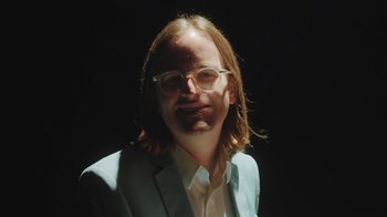Movie still from “Dent May - I Could Use A Miracle” (2020), directed by Nathan Castiel – Close Up shot, Low angle