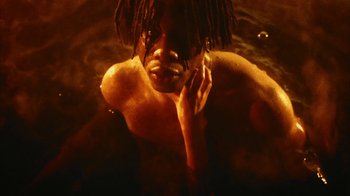 Movie still from “Octavian - Poison feat. Take A Daytrip, Obongjayar, Santi” (2020), directed by Owls – Close Up shot, Low angle