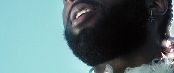 Movie still from “Rodney Chrome - Pulpit” (2020), directed by Zachary Dov Wiesel – Extreme Close Up shot, Low angle