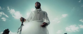 Movie still from “Rodney Chrome - Pulpit” (2020), directed by Zachary Dov Wiesel – Medium shot, Low angle