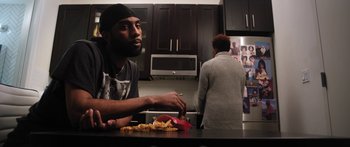 Movie still from “Rodney Chrome - Pulpit” (2020), directed by Zachary Dov Wiesel – Medium shot, Low angle