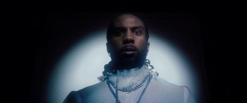 Movie still from “Rodney Chrome - Pulpit” (2020), directed by Zachary Dov Wiesel – Close Up shot, Low angle