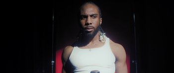 Movie still from “Rodney Chrome - Pulpit” (2020), directed by Zachary Dov Wiesel – Close Up shot, Low angle