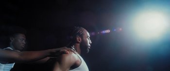 Movie still from “Rodney Chrome - Pulpit” (2020), directed by Zachary Dov Wiesel – Close Up shot, Low angle