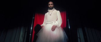 Movie still from “Rodney Chrome - Pulpit” (2020), directed by Zachary Dov Wiesel – Medium shot, Low angle