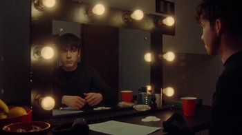 Movie still from “Declan McKenna - The Key to Life on Earth” (2020), directed by Will Hooper – Medium shot, High angle