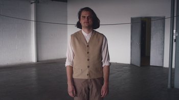 Movie still from “Alex Nicol - Trust” (2020), directed by Paz Ramirez – Medium shot, Low angle