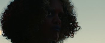 Movie still from “Kiccc - Here” (2019), directed by Riun Garner – Extreme Close Up shot, Low angle