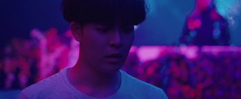 Movie still from “Kiccc - Here” (2019), directed by Riun Garner – Close Up shot, Low angle