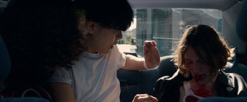 Movie still from “Kiccc - Here” (2019), directed by Riun Garner – Close Up shot, Over the shoulder angle