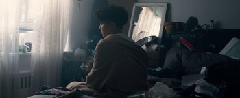 Movie still from “Kiccc - Here” (2019), directed by Riun Garner – Medium shot, Low angle