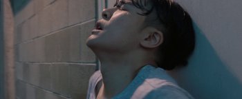 Movie still from “Kiccc - Here” (2019), directed by Riun Garner – Extreme Close Up shot, Low angle