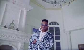 Movie still from “Rosalía & Ozuna - Yo x Ti, Tu x Mi” (2019), directed by Pasqual Gutierrez – Medium shot, Low angle