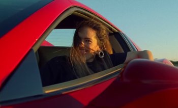 Movie still from “Rosalía & Ozuna - Yo x Ti, Tu x Mi” (2019), directed by Pasqual Gutierrez – Close Up shot, Low angle