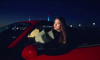 Movie still from “Rosalía & Ozuna - Yo x Ti, Tu x Mi” (2019), directed by Pasqual Gutierrez – Medium shot, Low angle