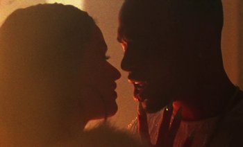 Movie still from “Rosalía & Ozuna - Yo x Ti, Tu x Mi” (2019), directed by Pasqual Gutierrez – Extreme Close Up shot, Over the shoulder angle