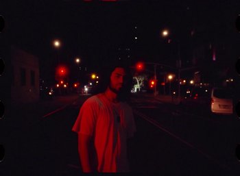 Movie still from “Ali Gatie - It’s You” (2019), directed by Nathan R. Smith – Medium shot, Low angle