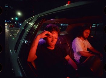 Movie still from “Ali Gatie - It’s You” (2019), directed by Nathan R. Smith – Medium shot, Low angle