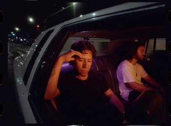 Movie still from “Ali Gatie - It’s You” (2019), directed by Nathan R. Smith – Medium shot, Low angle