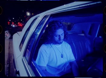 Movie still from “Ali Gatie - It’s You” (2019), directed by Nathan R. Smith – Medium shot, High angle