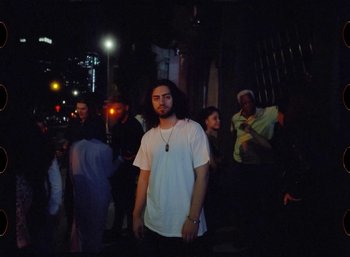 Movie still from “Ali Gatie - It’s You” (2019), directed by Nathan R. Smith – Medium shot, Low angle