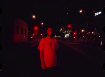 Movie still from “Ali Gatie - It’s You” (2019), directed by Nathan R. Smith – Medium shot, Low angle