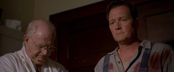 Movie still from “Walk the Line” (2005), directed by James Mangold – A man with a bloody shirt on his face; Close Up shot, Low angle