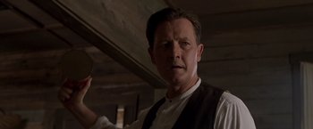 Movie still from “Walk the Line” (2005), directed by James Mangold – A person wearing a suit and tie; Close Up shot, Low angle