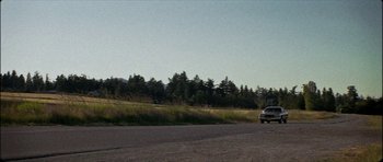 Movie still from “J Travis - Albatross” (2019), directed by Ft. Langley – Extreme Wide shot, Low angle