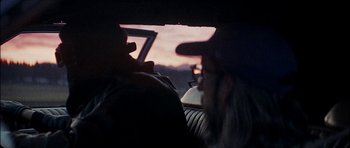 Movie still from “J Travis - Albatross” (2019), directed by Ft. Langley – Close Up shot, Over the shoulder angle