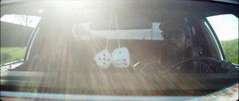 Movie still from “J Travis - Albatross” (2019), directed by Ft. Langley – Extreme Close Up shot, Low angle