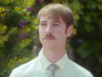 Movie still from “Colectivo Da Silva - Marina d’Or” (2019), directed by Kirkpatrick Buffet – Close Up shot, Low angle