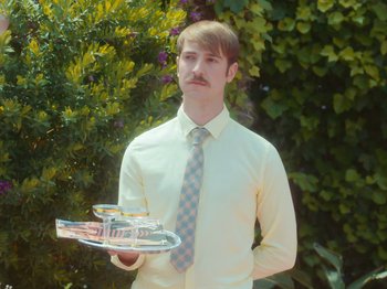 Movie still from “Colectivo Da Silva - Marina d’Or” (2019), directed by Kirkpatrick Buffet – Medium shot, Low angle