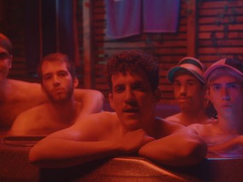 Movie still from “Colectivo Da Silva - Marina d’Or” (2019), directed by Kirkpatrick Buffet – Medium shot, Low angle