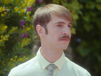 Movie still from “Colectivo Da Silva - Marina d’Or” (2019), directed by Kirkpatrick Buffet – Close Up shot, Low angle