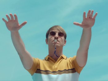 Movie still from “Colectivo Da Silva - Marina d’Or” (2019), directed by Kirkpatrick Buffet – Medium shot, Low angle