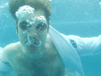 Movie still from “Colectivo Da Silva - Marina d’Or” (2019), directed by Kirkpatrick Buffet – Close Up shot, Overhead angle