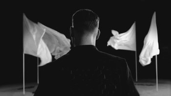 Movie still from “De Staat - Tie Me Down feat. Luwten” (2019), directed by Ruben Van Leer – Medium shot, Low angle