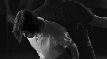 Movie still from “De Staat - Tie Me Down feat. Luwten” (2019), directed by Ruben Van Leer – Medium shot, Low angle