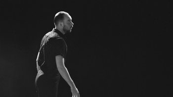 Movie still from “De Staat - Tie Me Down feat. Luwten” (2019), directed by Ruben Van Leer – Medium shot, Low angle