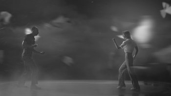 Movie still from “De Staat - Tie Me Down feat. Luwten” (2019), directed by Ruben Van Leer – Wide shot, Low angle