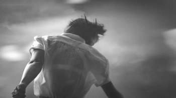 Movie still from “De Staat - Tie Me Down feat. Luwten” (2019), directed by Ruben Van Leer – Medium shot, Low angle