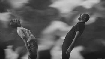 Movie still from “De Staat - Tie Me Down feat. Luwten” (2019), directed by Ruben Van Leer – Medium shot, Low angle