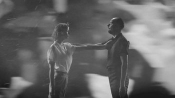 Movie still from “De Staat - Tie Me Down feat. Luwten” (2019), directed by Ruben Van Leer – Medium shot, Low angle