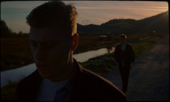 Movie still from “Premiere_ Jordan Klassen - Virtuous Circle” (2019), directed by Farhad Ghaderi – Close Up shot, Low angle