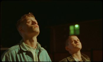 Movie still from “Premiere_ Jordan Klassen - Virtuous Circle” (2019), directed by Farhad Ghaderi – Medium shot, Low angle