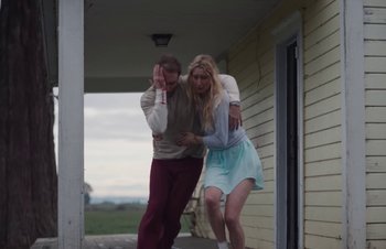 Movie still from “The Lumineers - Gloria” (2019), directed by Kevin Phillips – Medium shot, Low angle