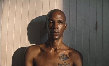 Movie still from “Andrzej Mrozek - Międzysmak” (2019), directed by Łukasz Zabłocki – Close Up shot, Low angle