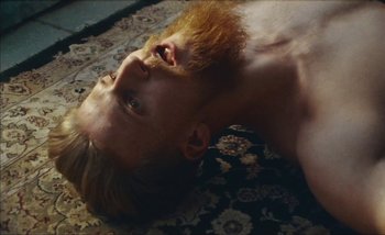 Movie still from “Andrzej Mrozek - Międzysmak” (2019), directed by Łukasz Zabłocki – Close Up shot, Overhead angle